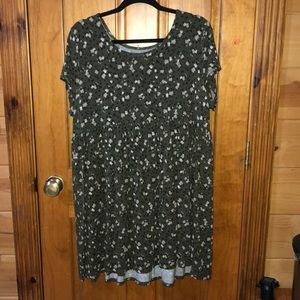 Green dress with flower pattern.